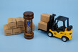 Forklift truck with carton boxes and hourglass on blue background. Storage and shipping time concept.	