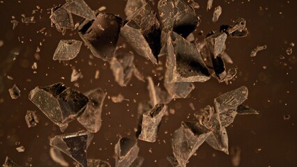 Canvas Print - Freeze motion of flying group of raw chocolate pieces.