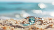 Beautiful Jewelry ring with clean aquamarine gem on sand beach background ai generative
