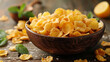  Crispy cornflakes in a wooden bowl on a rustic table