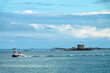 Boat passing near Brehon tower near St Peter Port, Guernsey, Channel islands landscape