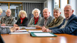 © Tatiana - residents committee meeting with 6 people aged 50 sitting around a table with folder of papers in front