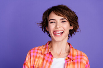 Canvas Print - Photo of pretty young girl tongue lick teeth wear shirt isolated on violet color background