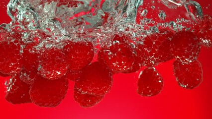 Poster - Super Slow Motion of Falling Raspberries Into Water on Red Background. Filmed on High Speed Cinema Camera, 1000 fps.