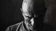 A bald man is bravely battling psychological stress as he fights to overcome life threatening brain tumor Witnessing the raw male emotions following cancer neurosurgery is truly heart wrench