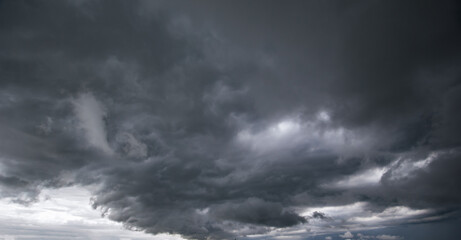 Aufkleber - The dark sky with heavy clouds converging and a violent storm before the rain.Bad or moody weather sky and environment. carbon dioxide emissions, greenhouse effect, global warming, climate change.