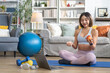 © Art_Photo - Portrait of sport slim fit strength asian woman training in sportswear relax and practicing yoga, fitness, exercise, wellness, workout, sport at home.Diet concept.Fitness and healthy lifestyle