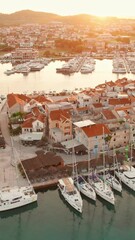 Wall Mural - Old town of Tribunj on a small island in Adriatic sea at sunrise, Dalmatia region of Croatia. Beautiful morning aerial view of the medieval Tribunj old town.