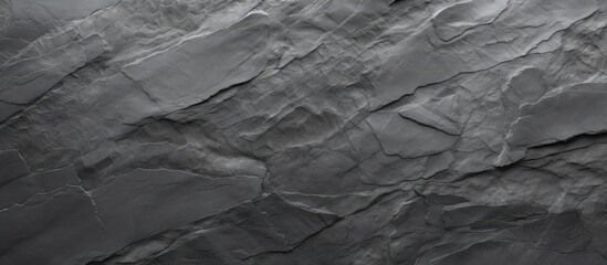 Poster - top view of a slate textured background in shades of gray providing a potential area for additional 