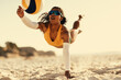 © Jacob Lund - Dynamic black woman playing beach volleyball in brazil