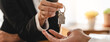 © Pormezz - Realtor agent giving a key of apartment to new owner after signed lease agreement.
