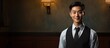 An Asian waiter posing for a portrait with ample copy space in the image