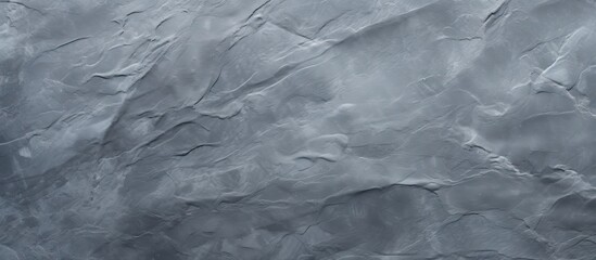 Poster - top view of a slate textured background in shades of gray providing a potential area for additional 