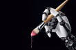 robotic hand holding paintbrush isolated on background