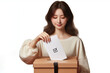 Woman voting by inserting a ballot into a box isolated white background
