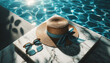 A stylish summer scene by a pool, featuring a straw hat and sunglasses resting on a white marble edge. The pool has sparkling turquoise waters