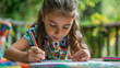 © Kateryna - Little girl drawing with colored pencils