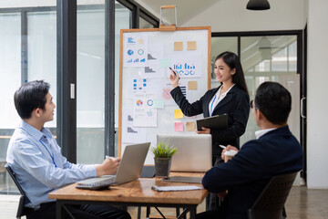 Wall Mural - Business people group meeting in office . Profession businesswomen businessmen and office workers working in team conference with project planning document on meeting table