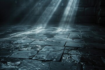 Poster - A stone-floored room with a single beam of light shining from the ceiling. Suitable for various design projects