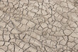 © Formatoriginal - Dried cracked earth soil ground background texture. Top view