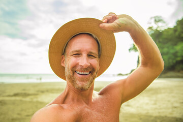 Wall Mural - nice man taking selfie portrait on beach