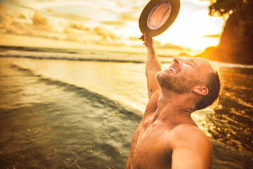 Wall Mural - nice man taking selfie portrait on beach