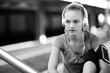 Active young woman working out with headphones outside
