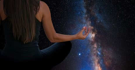 Wall Mural - Woman meditating with the universe in the background