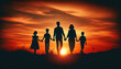 Silhouette of a family of five walking hand-in-hand against a sunset backdrop. The scene captures two adults and three children