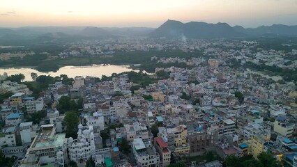 Wall Mural - Aerial view of Udaipur city during sunset, known for its beautiful lakes, palaces, and historical significance. The city was founded in 1559.