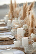 A beautifully decorated outdoor table with bouquets of dry flowers, pampas grass luxury tableware and cutlery