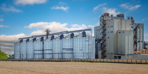 Wall Mural - silos granary elevator on agro-industrial complex with seed cleaning and drying line for grain storage