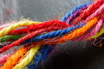 Wall Mural - colored threads twisted into one strand as a symbol of unity and teamwork.