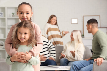 Wall Mural - Cute little sisters hugging at home