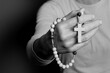 praying to god with cross and hands together with black background with people stock image stock photo