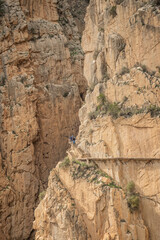 Wall Mural - hiking trail caminito del rey, kings walkway, in Malaga Spain. narrow footpath leads through natural beauty mountain range cliff faces of gaitanes gorge. hisotric landmark popular tourist attraction