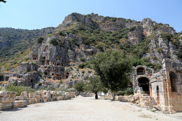 Wall Mural - Rocks with caves for the burial of people. Ancient city Myra. Lycia region, Antalya, Turkey.