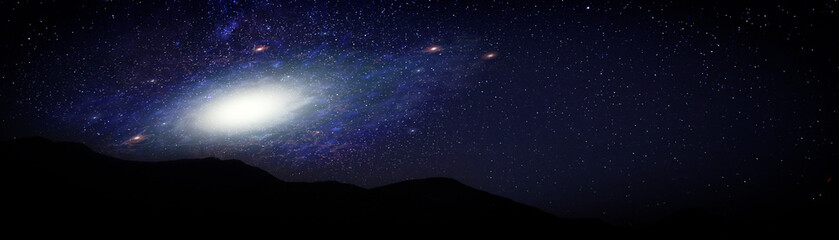 Wall Mural - Beautiful shiny galaxy in starry sky over mountains, banner design