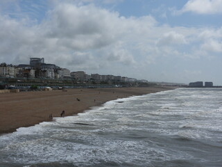 Sea with beach and city