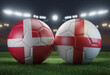 Two soccer balls in flags colors on a stadium blurred background. Group C. Denmark and England. 3D image.