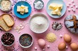 Flat lay of baking ingredients on a pink background, butter, flour, eggs, chocolate, bread

