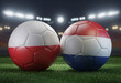 Two soccer balls in flags colors on a stadium blurred background. Group D. Poland and Netherlands. 3D image.