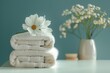 Towels Stack on Table With Flower