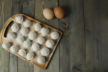 Canvas Print - The process of making dumplings. Shaping. Top view