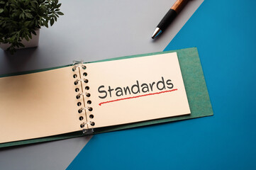 Poster - There is notebook with the word Standards. It is as an eye-catching image.