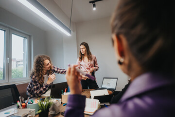 Canvas Print - A team of motivated colleagues engage in a lively business meeting, discussing statistics and strategies to enhance company growth.