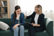 © New Africa - Psychotherapist working with patient on sofa in office