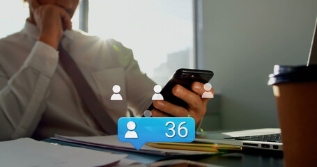 Poster - Image of media icons over caucasian businessman using smartphone