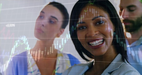Poster - Image of graphs moving over biracial smiling businesswoman with coworkers in office