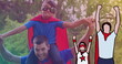 Image of superheroes over happy caucasian father and son dressed like superheroes in park